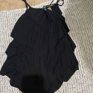 Ruffled black spaghetti strap top.